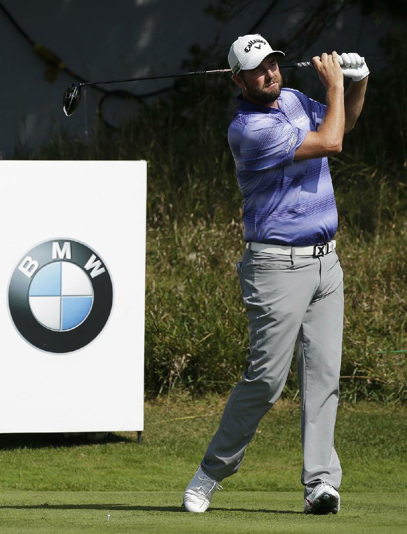 Marc Leishman watches his tee shot on the 14th hole during the first round of the BMW Championship golf tournament at Conway Farms Golf Club, Thursday, Sept. 14, 2017, in Lake Forest, Ill.