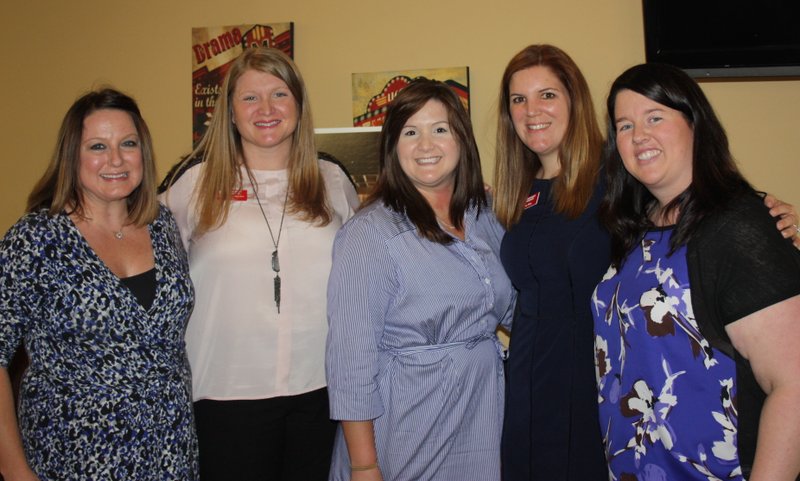 NWA Democrat-Gazette/CARIN SCHOPPMEYER Crystal Butler (from left), Misty Bolton-Samuels, Ashley Zulpo, Erin Hinz and Amber Holtz attend the Peace at Home expansion opening Sept. 6 at the shelter in Fayetteville.