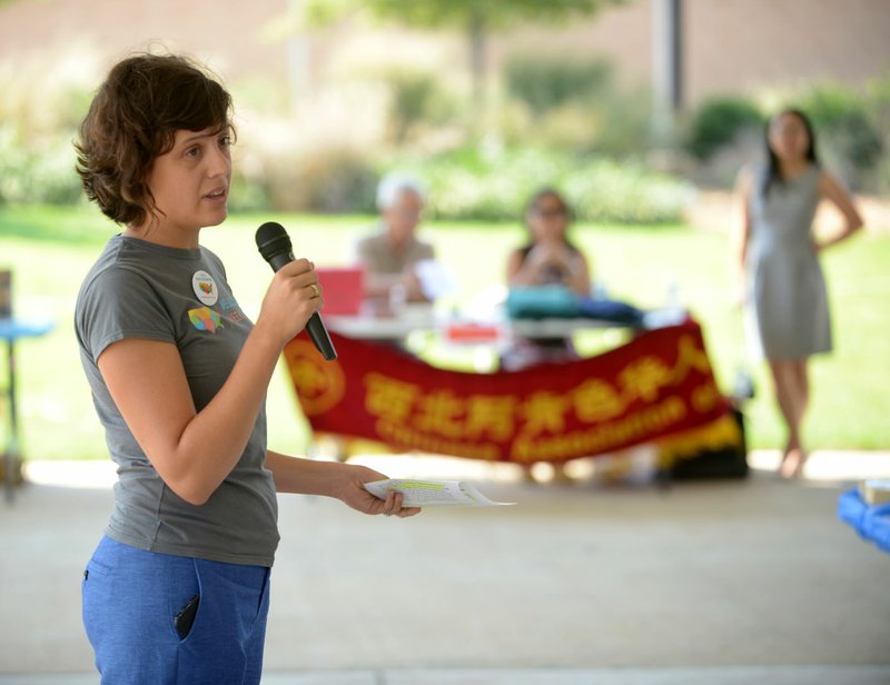 NWA Democrat-Gazette/ANDY SHUPE Margot Lemaster, director of the Northwest Arkansas Council's newly formed WelcomeNWA initiative, speaks Saturday during a local observance of National Welcoming Week hosted by EngageNWA and WelcomeNWA at Shiloh Square in downtown Springdale. The event featured information about area agencies for people new to Northwest Arkansas as well as performances by regional cultural groups.