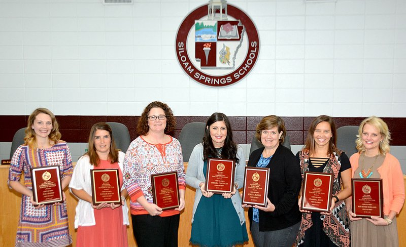 Janelle Jessen/Siloam Sunday Siloam Springs Schools announced the teachers of the year at Thursday&#8217;s school board meeting. Pictured, from left to right, are Tara Harris, Intermediate School teacher of the year; Natalie Hutto, Southside Elementary School teacher of the year; Lori Boyd, Middle School teacher of the year; Chelsea Chandler, Allen Elementary School teacher of the year; Loretta Radeke, High School teacher of the year; Trashell Snow, Main Street Academy teacher of the year; and Kourtnee Holland, Northside Elementary School teacher of the year.