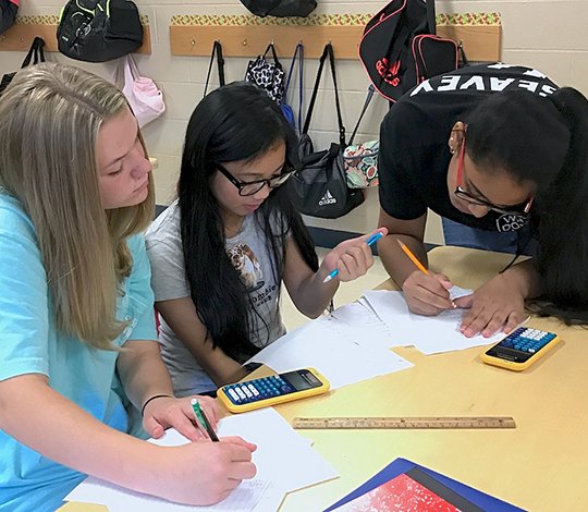 Submitted photo Lakeside Middle School students, from left, Richa Patel, Amanda Navarro and Anna Llewelyn recently worked together in Melissa Ellis' class to create an order of operations clock.