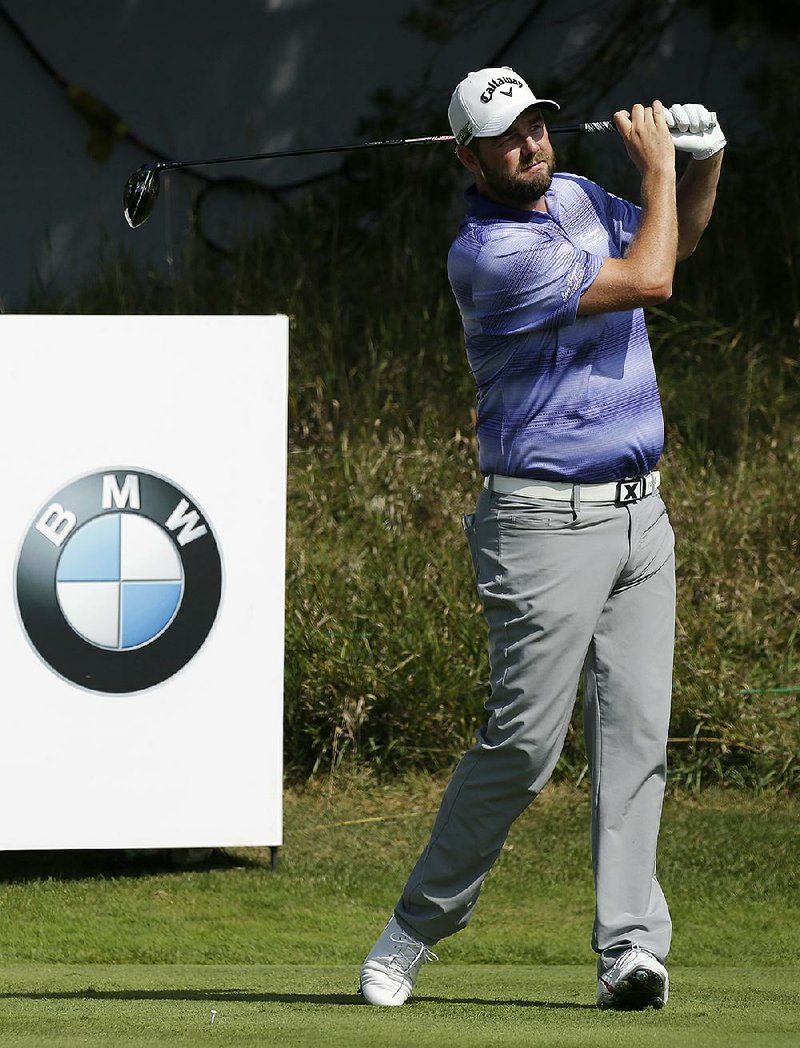 Marc Leishman watches his tee shot on the 14th hole during the first round of the BMW Championship golf tournament at Conway Farms Golf Club, Thursday, Sept. 14, 2017, in Lake Forest, Ill. 
