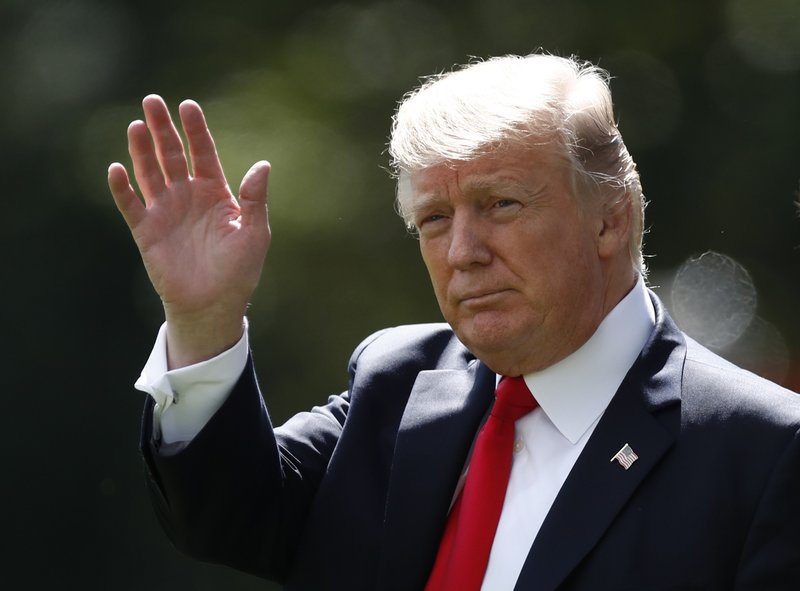 FILE - In this Sept. 15, 2017 file photo, President Donald Trump waves as he walks from the Oval Office of the White House in Washington to Marine One for the short trip to Andrews Air Force Base, Md. Facing an escalating nuclear threat from North Korea and the mass flight of minority Muslims from Myanmar, world leaders gather at the United Nations starting Monday, Sept. 18 to tackle these and other tough challenges _ from the spread of terrorism to a warming planet. The spotlight will be on Trump and France&#x2019;s new leader, Emmanuel Macron, who will both be making their first appearance at the General Assembly. (AP Photo/Carolyn Kaster)