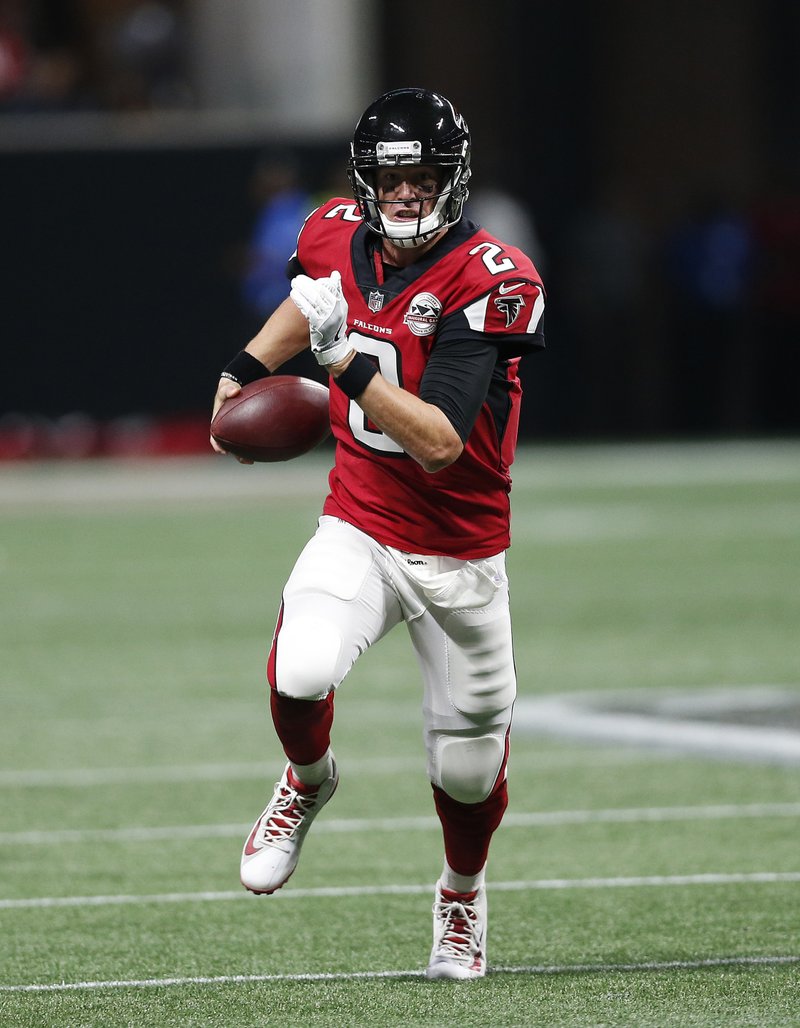 Atlanta Falcons quarterback Matt Ryan runs out of the pocket during the first half of Sunday’s game against the Green Bay Packers in Atlanta.
