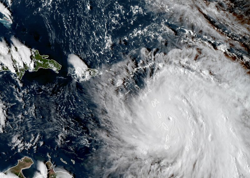 This Monday, Sept. 18, 2017, GOES East satellite image provided by NASA taken at 20:30 UTC, shows the eye of Hurricane Maria as it nears Dominica. 