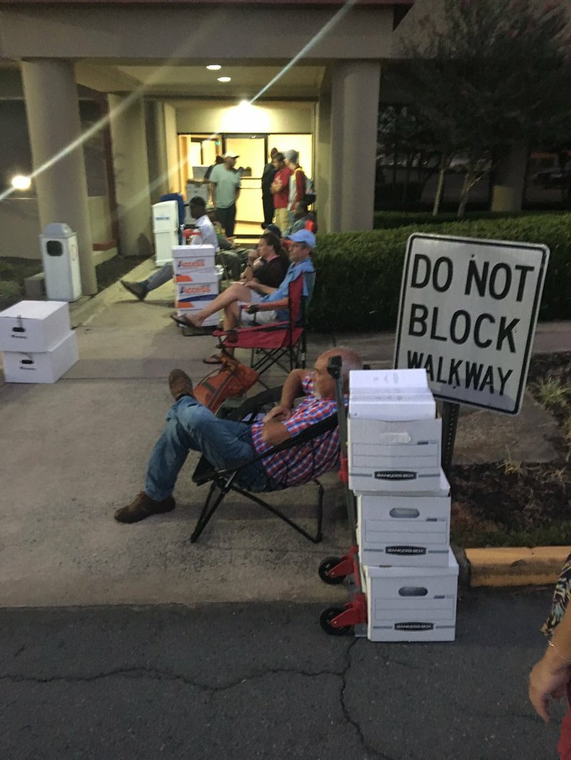 Applicants for medical marijuana cultivation and dispensary licenses wait for state offices to open Monday, Sept. 18, 2017. 