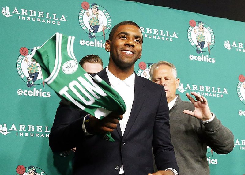 Kyrie Irving said Monday in an ESPN interview that he is looking forward to “actually playing point guard” with
the Celtics.