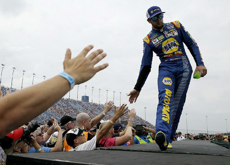 Chase Elliott greets fans before Sunday’s NASCAR Cup Monster Energy Series race at Chicagoland Speedway
in Joliet, Ill. Elliott matched his career-best finish of second, behind championship favorite Martin Truex Jr.