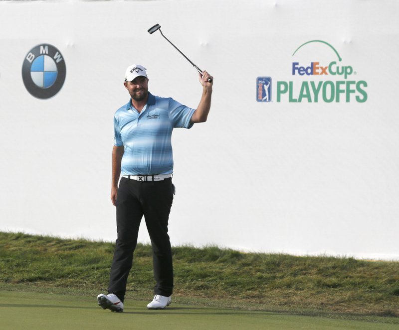 The Associated Press DREAMING BIG: Marc Leishman celebrates after winning the BMW Championship at Conway Farms Golf Club Sunday in Lake Forest, Ill.