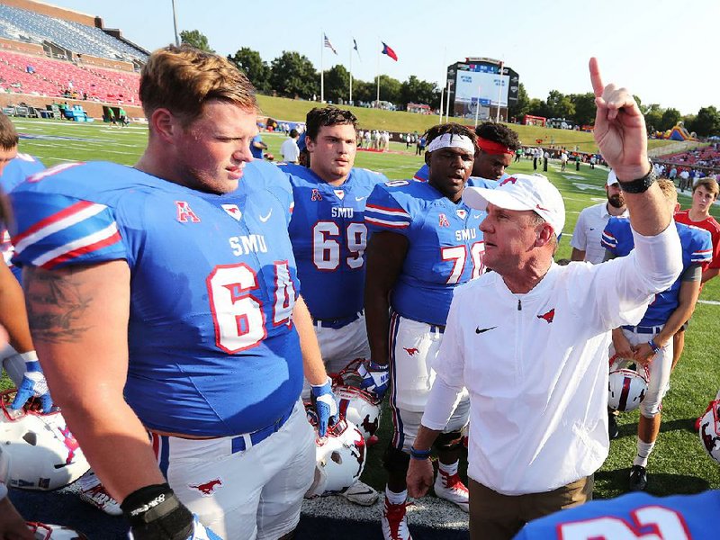 SMU Coach Chad Morris (right) contacted Arkansas State Coach Blake Anderson for guidance in 2014, as Anderson was completing his first season at ASU and just after Morris had accepted his first collegiate head coach position with the Mustangs. 
