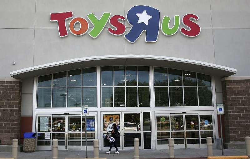 A customer walks into a Toys R Us store in Dallas on Tuesday. The retailer has filed for bankruptcy protection. 