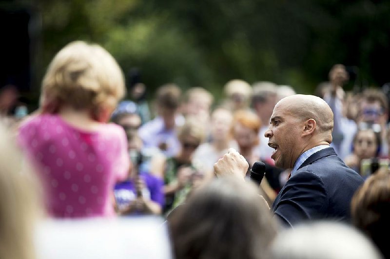 Sen. Cory Booker, D-N.J., speaks Tuesday at a rally of health care advocates, grass-roots activists and others outside the Capitol in Washington, where he called for the protection of the current health care law. 
