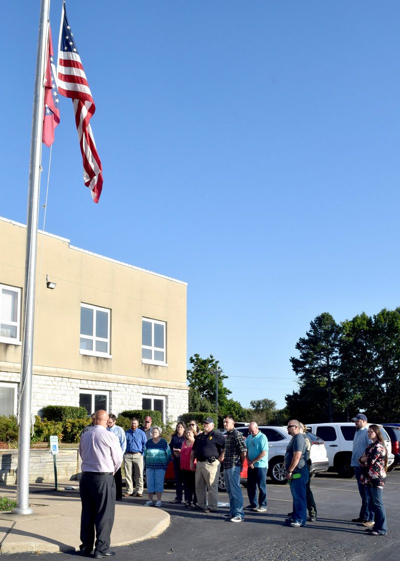 Photo by Mike Eckels Near the front entrance of city hall on Sept. 11, Decatur Mayor Bob Tharp leads the Decatur City Council, department heads and guests in a moment of silence in remembrance of the 16th anniversary of the 911 attack on this country.