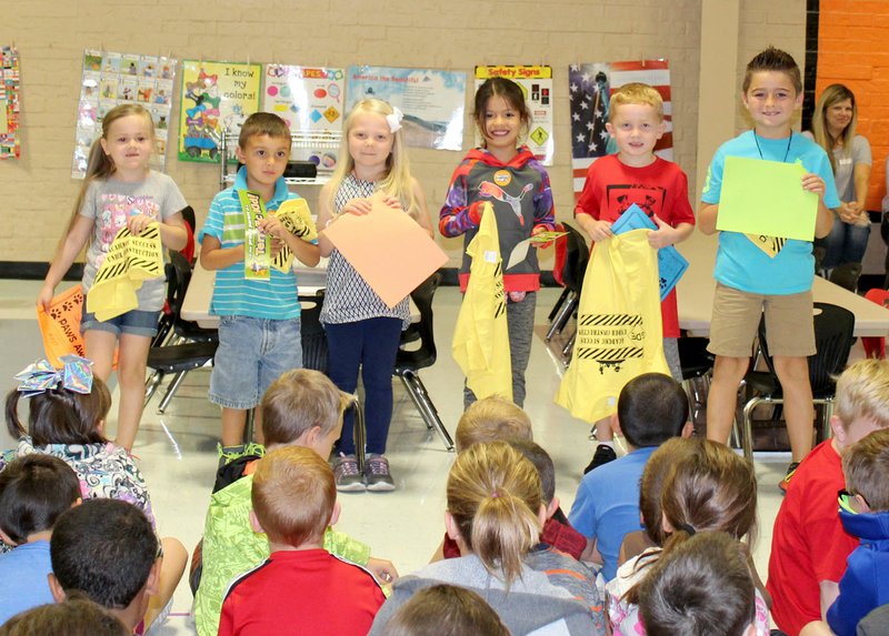 Submitted Photo PAWS (&#8220;Pawsitive&#8221; and Wise) Students of the Month at Glenn Duffy Elementary School were honored at the school&#8217;s first assembly of the year. PAWS skills are discussed in the classroom in relation to character education. PAWS Students of the Month for September are Catherine Collins (left), second grade; Cody Benson, kindergarten; Bailey Harris, kindergarten; Angelina Martinez, first grade; Liam McBride, first grade; and Rome Parker, second grade.