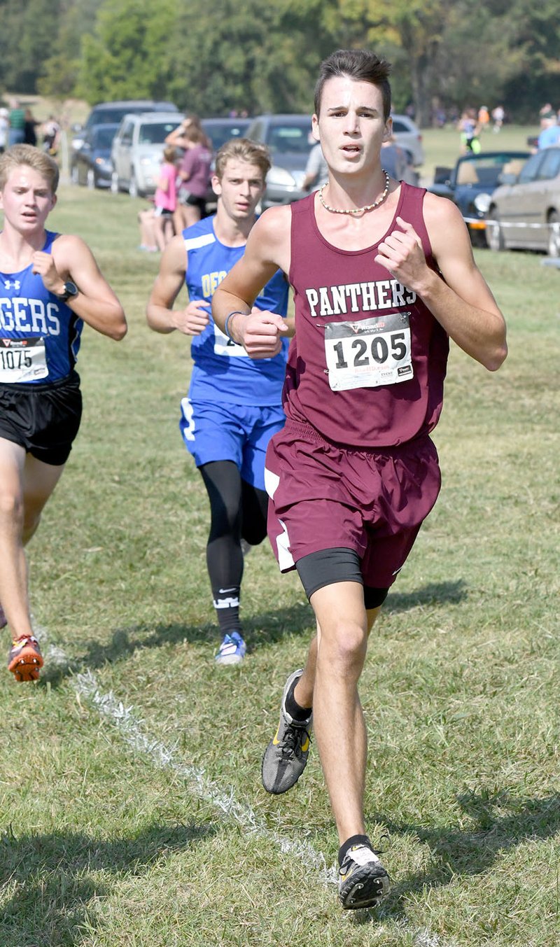 Bud Sullins/Special to the Herald-Leader Siloam Springs senior Isaac Leachman finished in fifth place in the large school boys division of the Panther Cross Country Classic on Saturday at the Simmons Course.