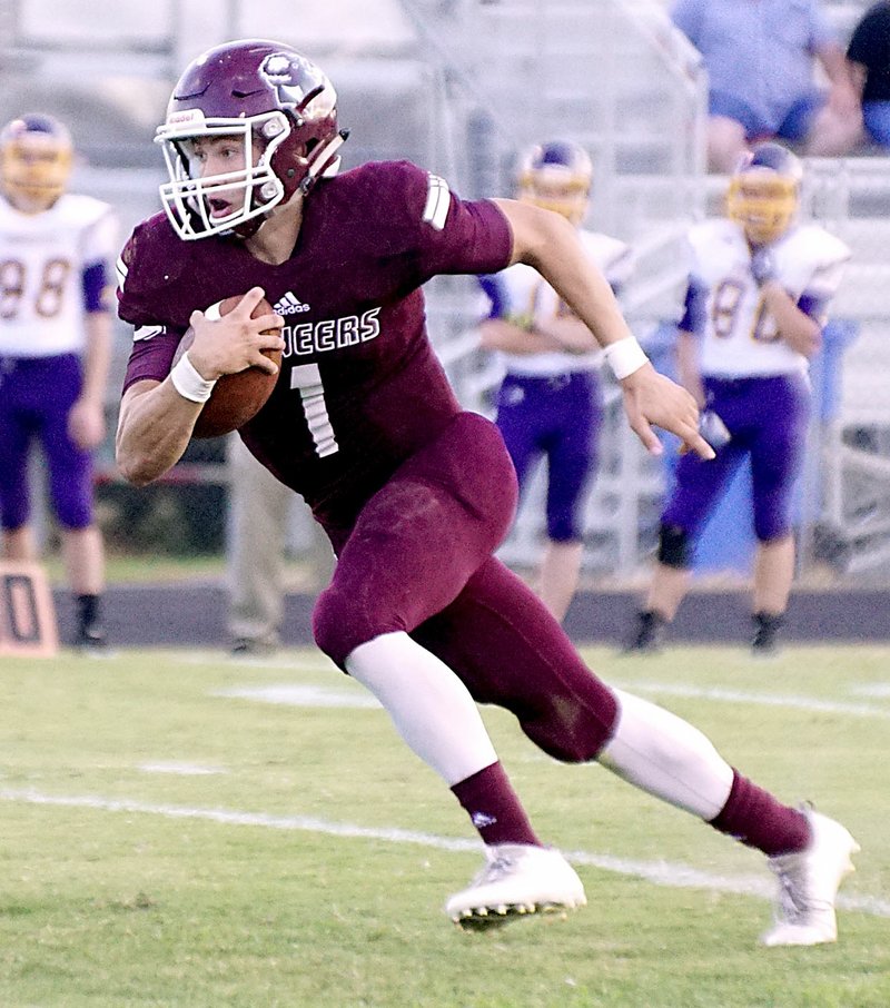 File Photo by Randy Moll Gentry quarterback Jon Faulkenberry runs the ball during a home game against Lavaca earlier in the season.