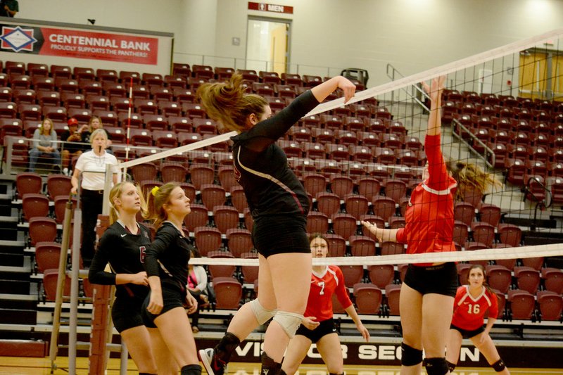 Graham Thomas/Herald-Leader Siloam Springs senior Allie Bowman goes up for a hit against Farmington as teammates, from left, Ellie Lampton and Chloe Price look on Monday inside Panther Activity Center. Bowman had nine kills as the Lady Panthers defeated the Lady Cardinals 3-1 in a 5A/6A District 1 volleyball match.