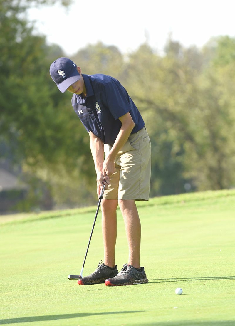 NWA Democrat-Gazette/FLIP PUTTHOFF Shiloh Christian’s Ben Fowler putts Tuesday during the 4A-1 Conference Golf Tournament.