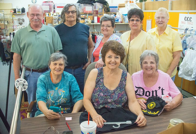 Sitting, from left, Marilyn Poe, Barbara Green and Linda Wilson; and standing, Bobby Hargis, Ted Garcia, Willie Ware, Sherrie Logan and Sharon Pattison, all volunteers, are shown in the Cleburne County Cares retail store in Heber Springs. Hargis said the volunteers make the nonprofit organization special, often dedicating at least two or three days a week to work in the pantry and retail store.