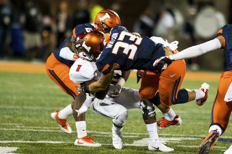 Illinois linebacker Tre Watson (33) hits Western Kentucky wide receiver Nacarius Fant (1) during the second quarter Sept. 9 in Champaign, Ill. Watson was called for targeting and was ejected from the game. 
