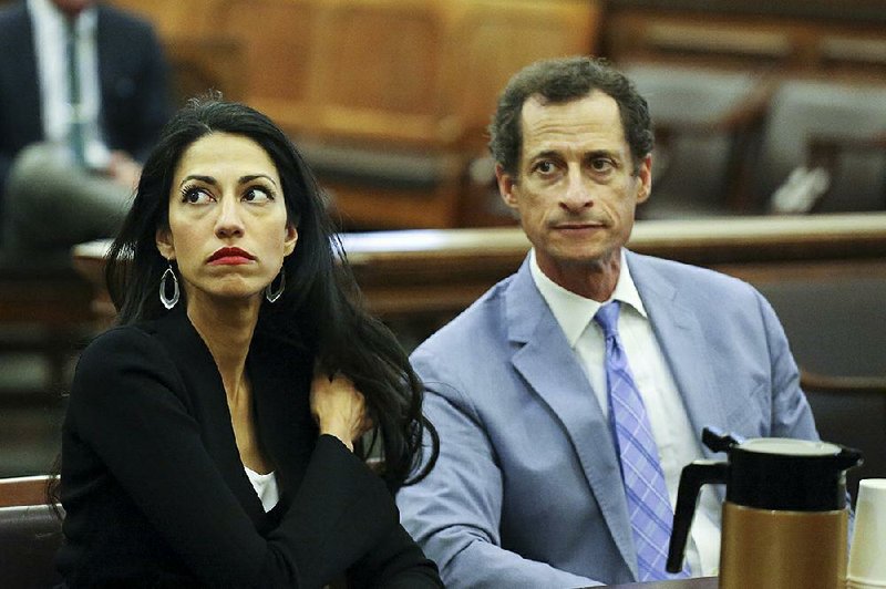 Anthony Weiner, right, and Huma Abedin are seen in court, Wednesday, Sept. 13, 2017 in New York. The couple appeared before a New York City judge to ask for privacy in their divorce case. 
