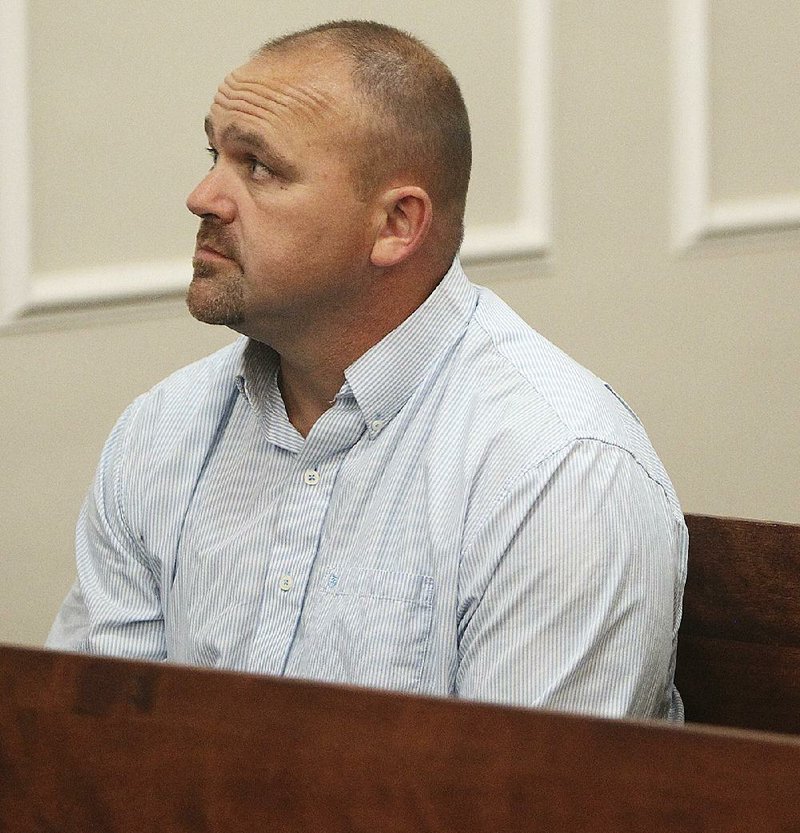 Gilbert “Toby” Curtsinger sits in the Franklin County Circuit Court in Frankfort, Ky., on May 22 2015. Curtsinger, indicted in 2015, pleaded guilty Wednesday to charges including theft by unlawful taking and receiving stolen property.