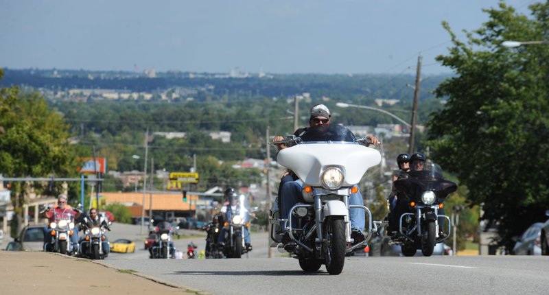 NWA Democrat-Gazette/ANDY SHUPE
Motorcyclists ride Saturday, Sept. 24, 2016, on College Avenue in Fayetteville during the 17th annual Bikes, Blues & BBQ motorcycle rally in Fayetteville. Visit nwadg.com/photos to see more photographs from the rally.