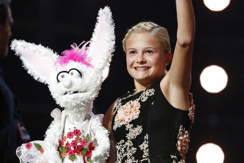 This Wednesday, Sept. 20, 2017, photo shows Darci Lynne Farmer on "America's Got Talent" in Los Angeles. 