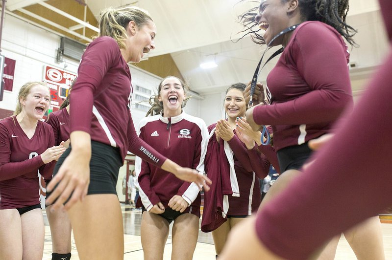 NWA Democrat-Gazette/CHARLIE KAIJO Springdale High players celebrate Thursday after defeating Rogers High 3-1 at Springdale High School.