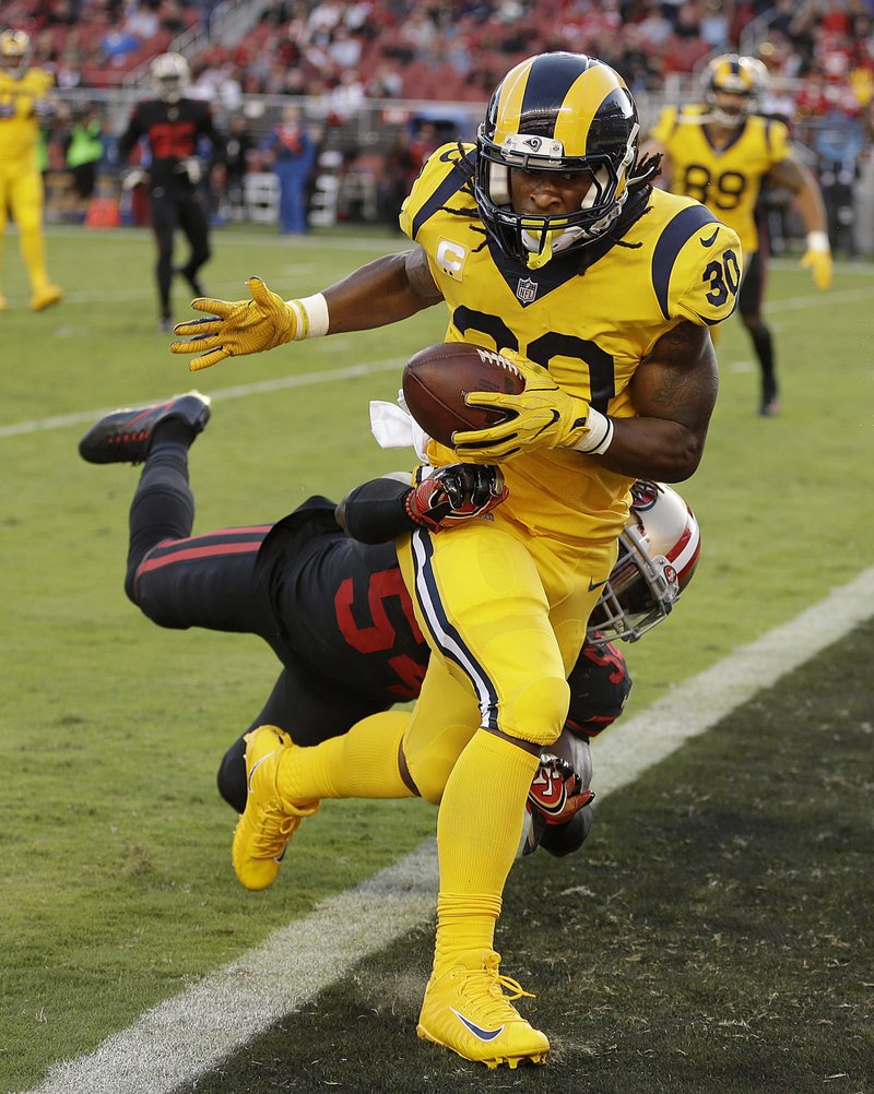 Rams running back Todd Gurley (30) scores a touchdown ahead of 49ers defensive back Dontae Johnson on Thursday in Santa Clara, Calif.