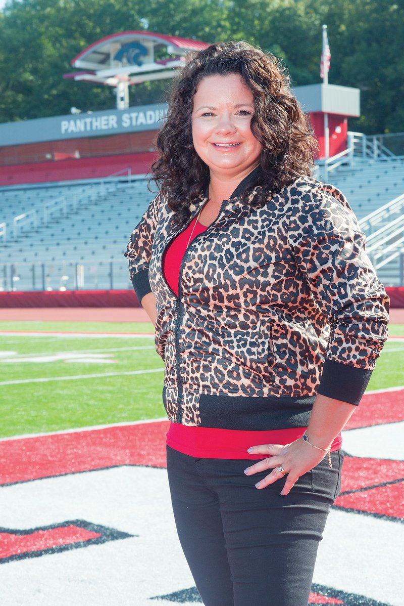 Cindy Jones stands on the field at Cabot High School’s football stadium. Jones said the Cabot Panther Foundation and Centennial Bank recently contributed funds to purchase and install Arkansas’ largest video board at Panther Stadium.