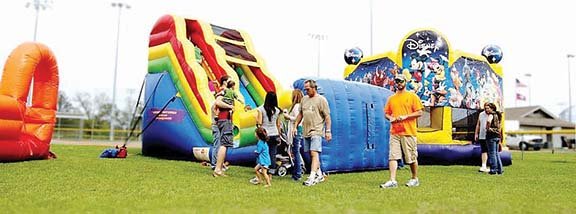 Children play on the inflatables at last year’s Quitmanfest. The event will take place from 10 a.m. to 8 p.m. Saturday and feature live entertainment, activities for kids, contests, vendors and a car show.