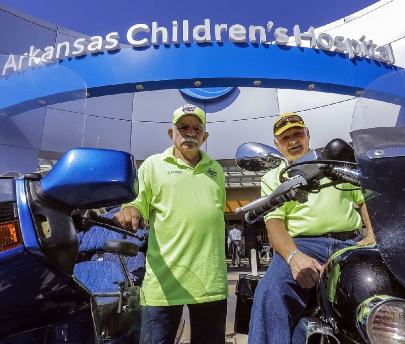 Harold Wilson (left) and Bill Martin, co-chairman and chairman of Arkansas Bikers for Children, park their bikes right in front of Arkansas Children’s Hospital. The organization has raised more than $300,000 for the hospital in just 5½ years.
