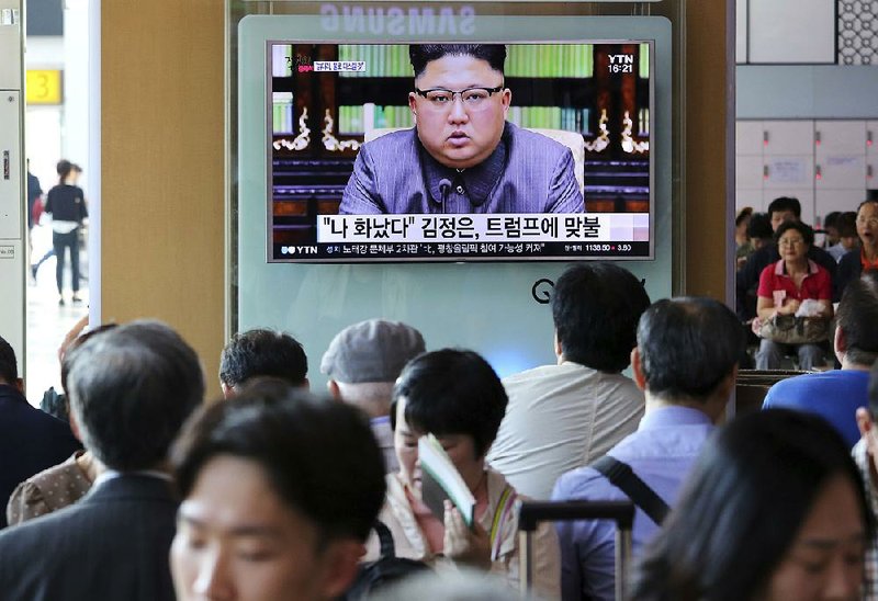 People watch a TV screen Friday in Seoul, South Korea, that shows North Korean leader Kim Jong Un delivering a statement in response to President Donald Trump’s speech to the United Nations. The screen reads “I was angry.” 