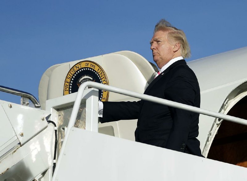 President Donald Trump boards Air Force One in Morristown, N.J., to travel Friday to Huntsville, Ala., for a campaign rally for Senate candidate Luther Strange. 
