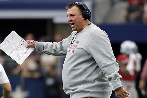 Arkansas head coach Bret Bielema cheers on his team after a score in the first half of an NCAA college football game against Texas A&M on Saturday, Sept. 23, 2017, in Arlington, Texas. (AP Photo/Tony Gutierrez)

