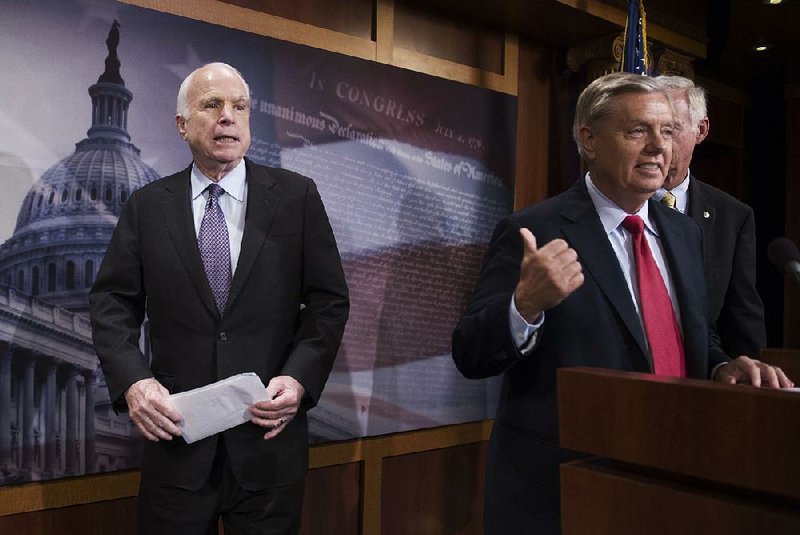 Sen. John McCain (left) waits onstage July 27 as fellow Republican Sen. Lindsey Graham talks about health care legislation. McCain “let his best friend [Graham] down” by opposing Graham’s repeal bill, President Donald Trump said in a tweet Saturday. 