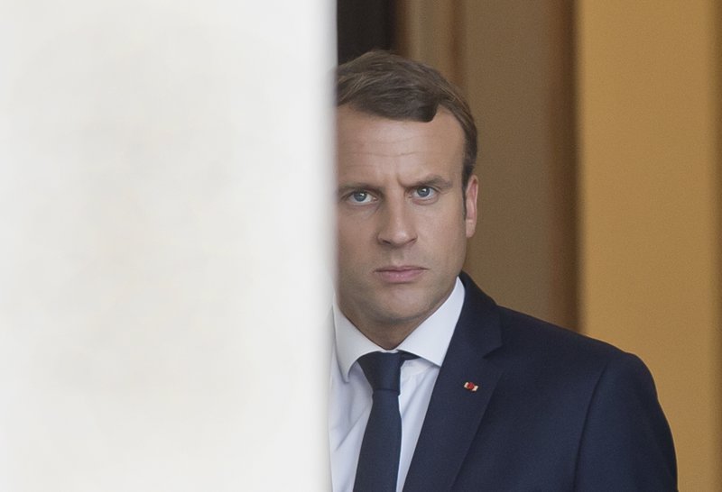 French President French President Emmanuel Macron walks out of the Elysee Palace as he awaits European Parliament President Antonio Tajani in Paris, France, Friday, Sept. 22, 2017. 