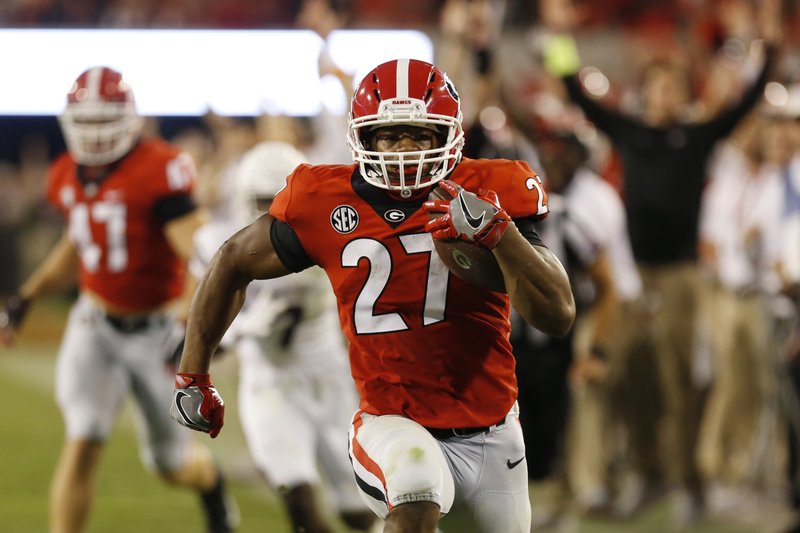 Georgia tailback Nick Chubb (27) runs on the way to a touchdown in the second half against Mississippi State during an NCAA college football game Saturday, Sept. 23, 2017, in Athens, Ga. (Joshua L. Jones/Athens Banner-Herald via AP)