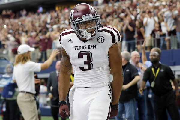 Texas A&M wide receiver Christian Kirk (3) celebrates catching a touchdown pass in overtime of an NCAA college football game against Arkansas on Saturday, Sept. 23, 2017, in Arlington, Texas. (AP Photo/Tony Gutierrez)