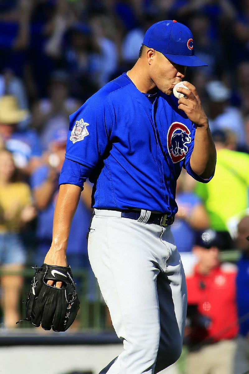 Jose Quintana pitched a three-hitter for his second big-league shutout, and the Chicago Cubs beat Milwaukee 5-0 Sunday to close in on a second consecutive NL Central title.