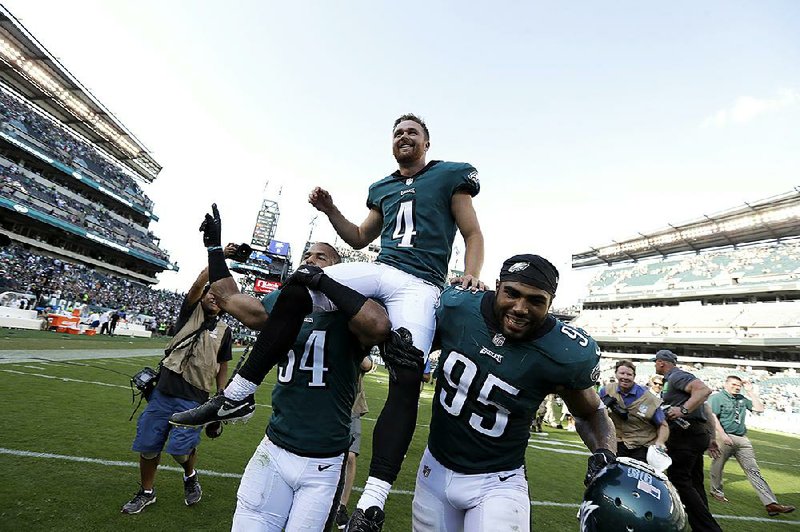 Philadelphia Eagles’ Jake Elliott is carried off the field after kicking a game-winning 61-yard field goal against the New York Giants on Sunday in Philadelphia.