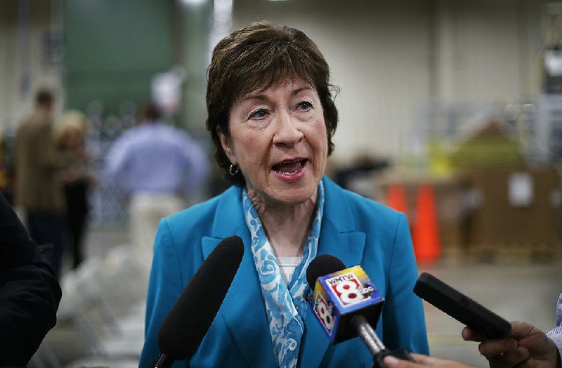 In this Thursday, Aug. 17, 2017, file photo, U.S. Sen. Susan Collins, R-Maine, speaks to members of the media while attending an event in Lewiston, Maine. 