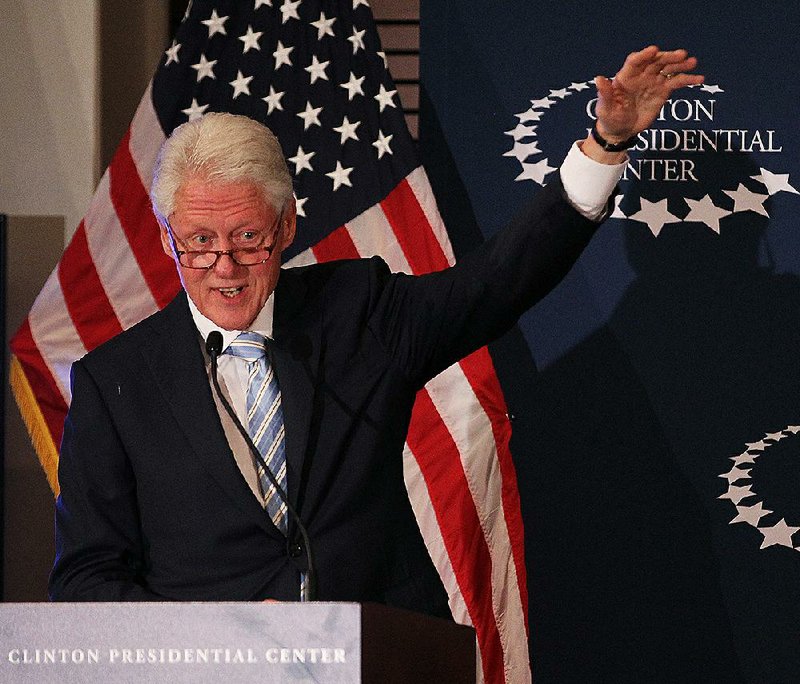Former President Bill Clinton tells a story about Nelson Mandela during an appearance Sunday night at  the Clinton Presidential Center in Little Rock.