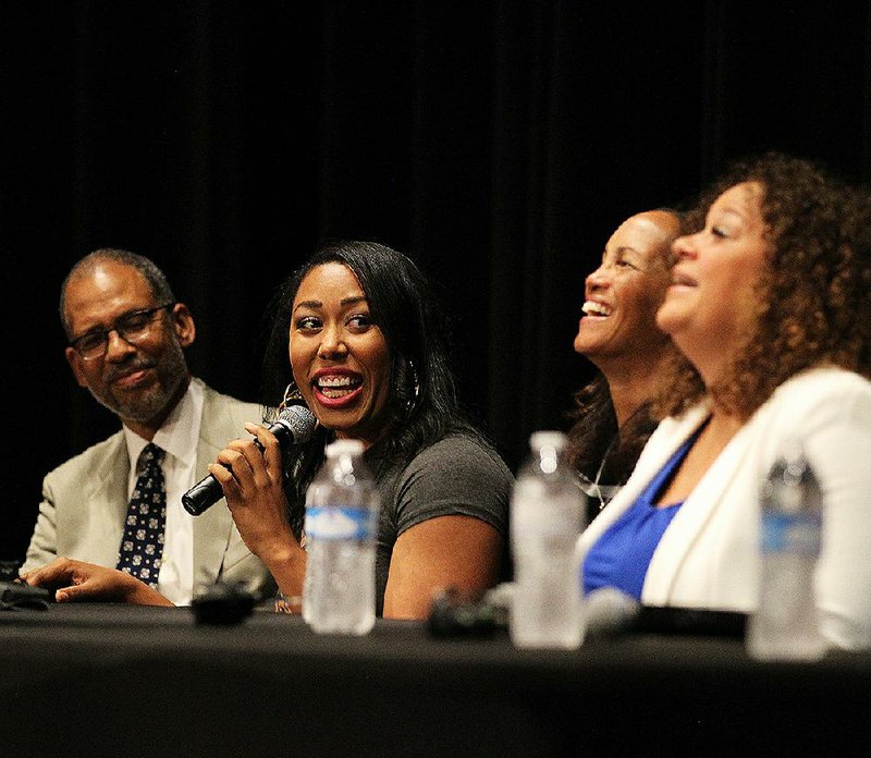MacKenzie Green (second from left), daughter of Ernest Green, tells a story Sunday during the Children of the Little Rock Nine panel at Ron Robinson Theater in Little Rock.