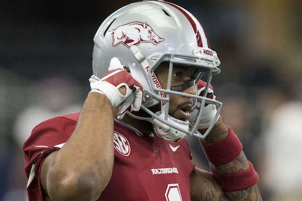 Jared Cornelius, Arkansas wide receiver, adjusts his helmet while warming up Saturday, Sept. 23, 2017, before the Southwest Classic at AT&T Stadium in Arlington, Texas. 