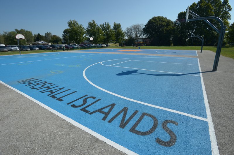 The outdoor basketball court at The Jones Center in Springdale as seen Saturday features a map of the Marshall Islands and a large compass rose.