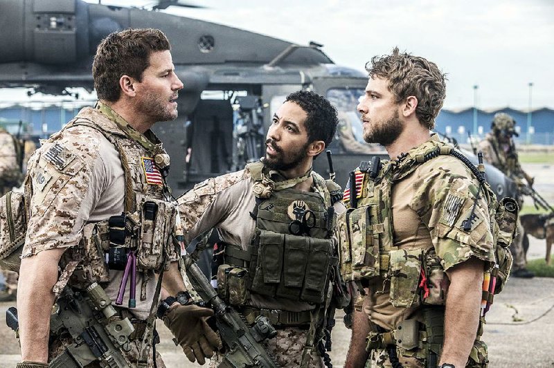 SEAL Team, a new military action series from CBS, stars (from left) David Boreanaz, Neil Brown Jr., and Max Thieriot. The drama debuts at 8 p.m. Wednesday.