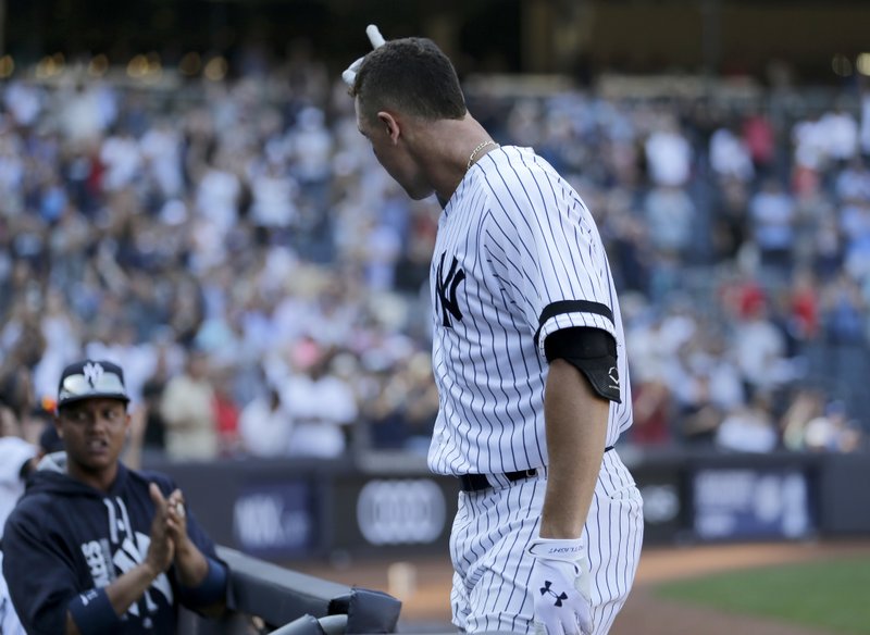 New York Yankees' Aaron Judge acknowledges the crowd after hitting a solo home run during the seventh inning of a baseball game against the Kansas City Royals at Yankee Stadium, Monday, Sept. 25, 2017, in New York. It was Judge's 50th home run, which sets a new record the most home runs hit by a rookie in the MLB. 