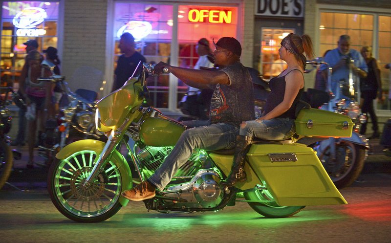Motorcyclists make their way along Dickson Street in Fayetteville on Saturday during the 18th annual Bikes, Blues & BBQ festival.